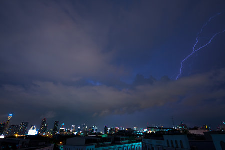 Stroke of lightning with storm clouds