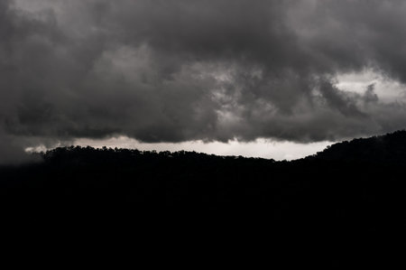 Strom clouds above rainforest at Viewpoint Of Khao Yai National Park, Nakhonratsima, THAILANDの写真素材