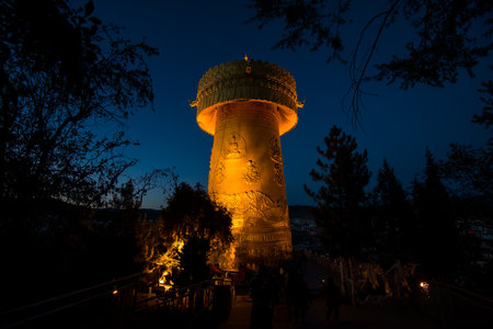 night light of huge golden prayer wheel in Shangri-La, Chinaの写真素材