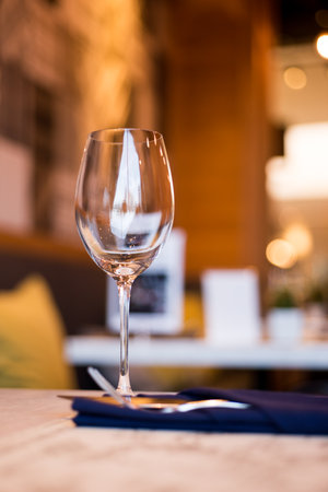 Empty Wine Glasses on table in restaurantの写真素材