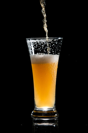 craft beer glass on black backgroundの写真素材