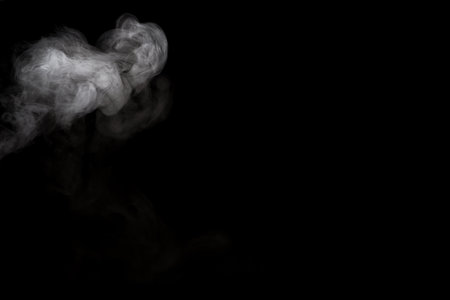 White smoke isolated on black background.の写真素材