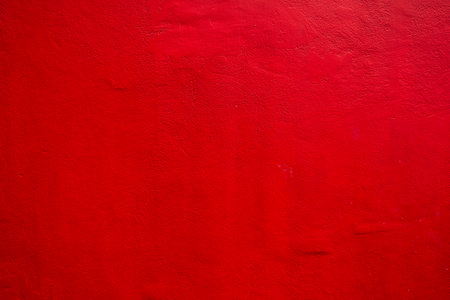 Real Red color painting on cement wall for backgroundの写真素材