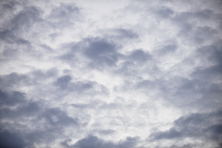 Rain clouds forming with blue sky backgroundの写真素材