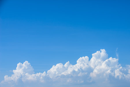 Rain clouds forming with blue sky backgroundの写真素材