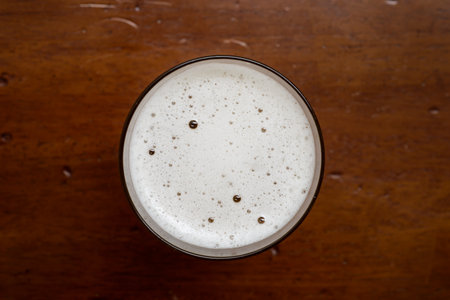 Glass of beer top view with beautiful beer bubbles texture