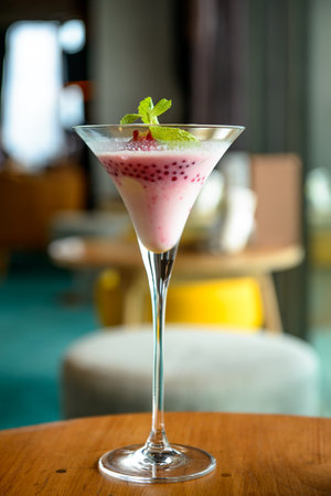 Glasses of cocktail on wooden table in Loungeの写真素材