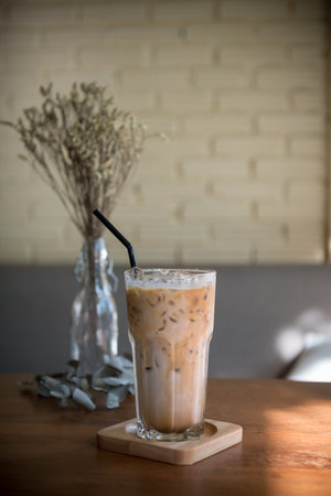 Iced latte coffee on wooden table