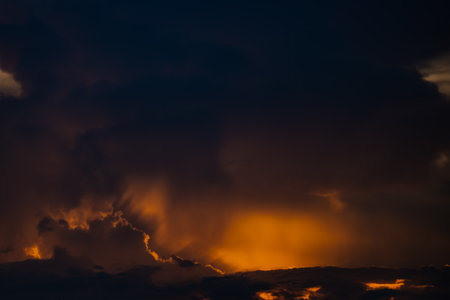 Clouds with sunset sky background wallpaper; colorful twilight sunsetの写真素材