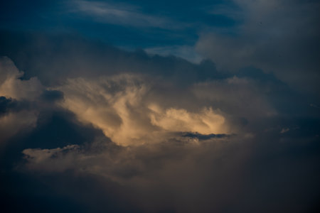 Clouds with sunset sky background wallpaper; colorful twilight sunsetの写真素材