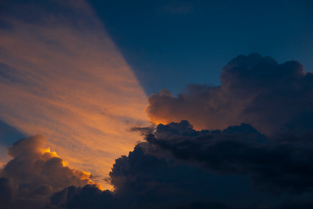Clouds with sunset sky background wallpaper; colorful twilight sunsetの写真素材