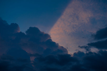 Clouds with sunset sky background wallpaper; colorful twilight sunsetの写真素材