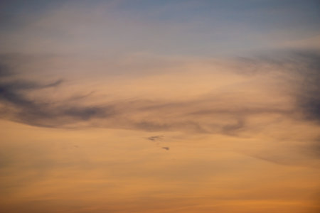 Clouds with sunset sky background wallpaper; colorful twilight sunsetの写真素材