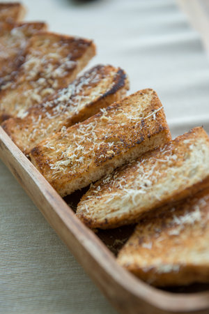 Baked bread with cheese and garlicの写真素材