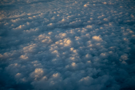 beautiful sky and clouds from window of planeの写真素材