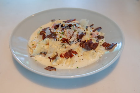 Truffle Alfredo Sauce: Delicately drizzled, elevating any dish with its exquisite flavor.の写真素材