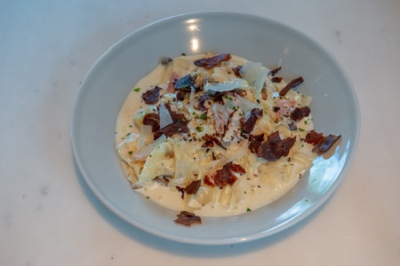Truffle Alfredo Sauce: Delicately drizzled, elevating any dish with its exquisite flavor.の写真素材