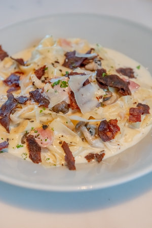 Truffle Alfredo Sauce: Delicately drizzled, elevating any dish with its exquisite flavor.の写真素材