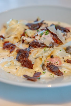 Truffle Alfredo Sauce: Delicately drizzled, elevating any dish with its exquisite flavor.の写真素材