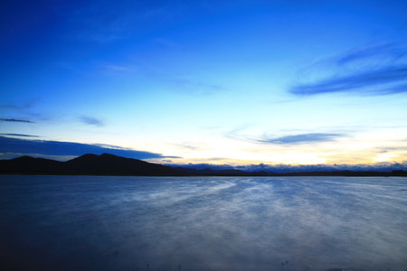 sunset over mountain and lakeの写真素材