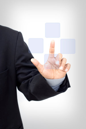 Business person pushing symbols on a touch screenの写真素材