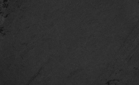 Beautiful background of a dark slate stone in close-up. Ideal for culinary or product presentation project.の写真素材