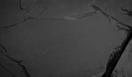 Beautiful background of a dark slate stone in close-up. Ideal for culinary or product presentation project.の写真素材