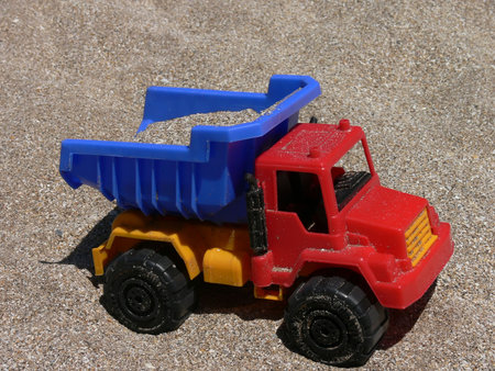 PLASTIC TOY TRUCK TO PLAY ON THE BEACHの写真素材