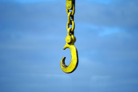 big yellow hook of a port crane        の写真素材