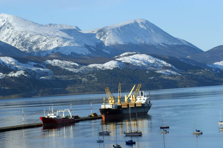 A cargo ship and a fishing vessel in the port