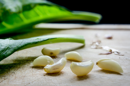 garlic on chopping woodの写真素材