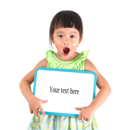 Little asian girl holding whiteboardの写真素材