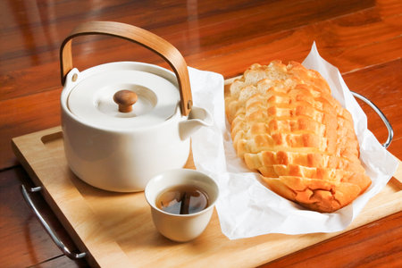 bread and tea on wood table