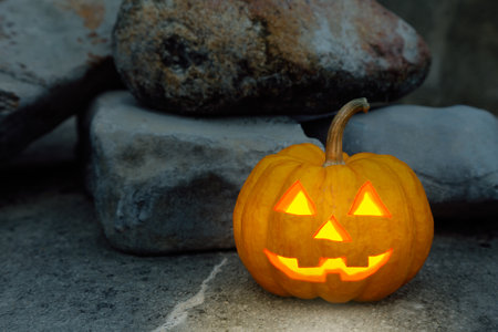 halloween pumpkin in rock sceneの写真素材