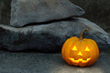 halloween pumpkin in dark rock sceneの写真素材