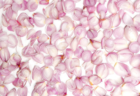 red onion, shallots sliced on white background