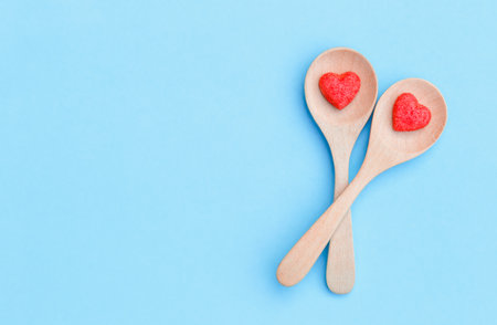 sugar candy shape heart on wooden spoonの写真素材
