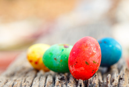 colorful eggs easter photo closeup on old woodの写真素材