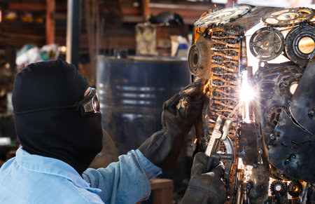 Closeup of welder working in workshop.
