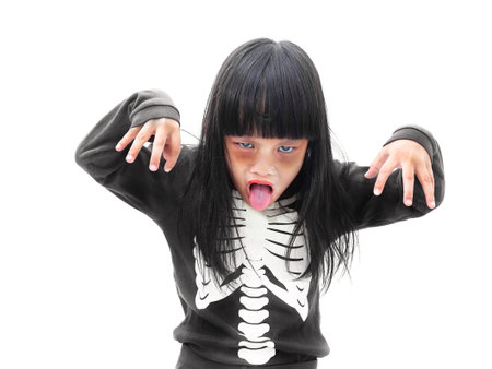 Little Asian girl in Halloween zombie make up isolated on white backgroundの写真素材