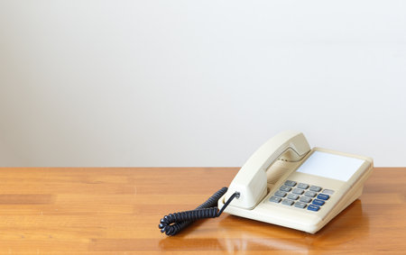 Vintage telephone on wooden tableの写真素材
