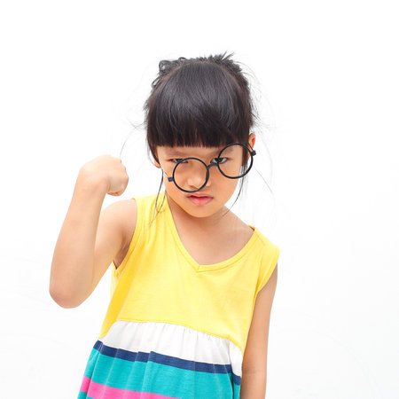 Asian little girl in fight actingの写真素材