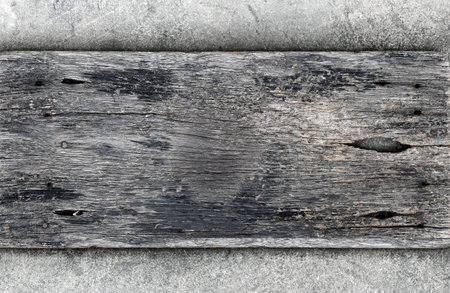 Weathered wood on dirty mortar floor