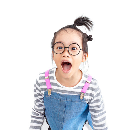 chinese naughty girl shouting loud with surprise face isolated on white backgroundの写真素材