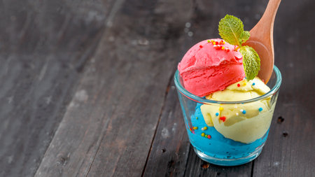 Colorful home made ice cream on dark wood background