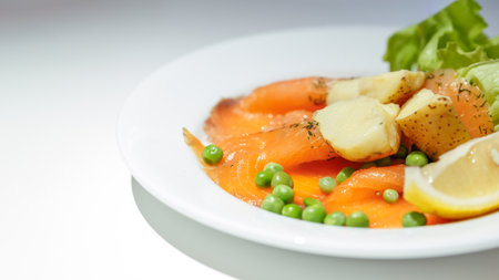 salmon gravlax on white dishの写真素材