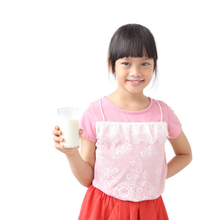 Asian girl drinking milk Isolated on white backgroundの写真素材