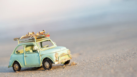 Miniature  tin car  closeup at summer beach sceneの写真素材