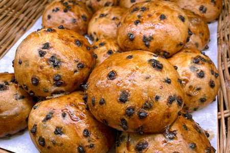 Whole grain bread bun containing sesame, pumpkin seeds, sunflower seeds toppingの写真素材