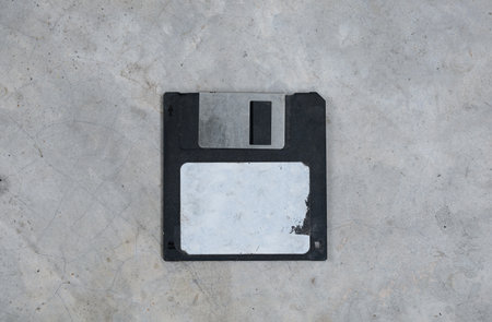 Old flobby disk on concrete floor.